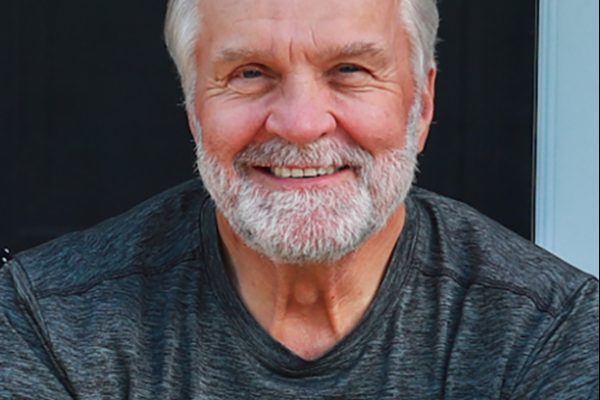 Ted Kuczynski posing for a headshot.