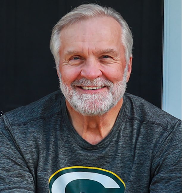 Ted Kuczynski posing for a headshot.