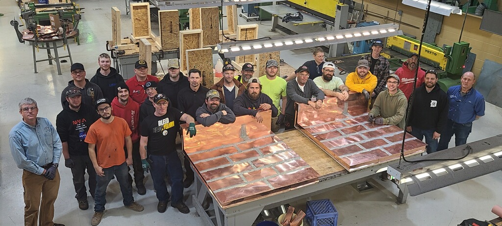 Sheet Metal Workers Local 80 soldering class aerial photo of members in the workshop
